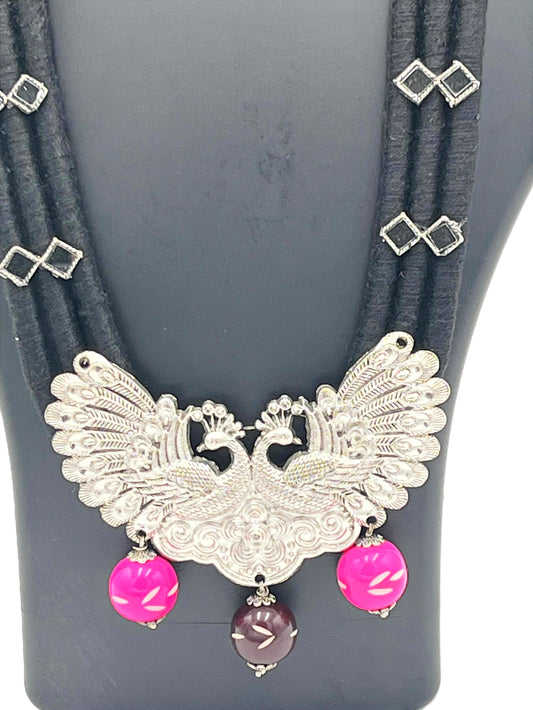The Chakmak Rang Tarang – Black Thread Necklace with Dual Peacock Oxidized Pendant & Pink-Bead Danglers