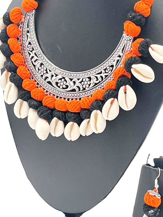The Chakmak Rang Tarang – Handcrafted Orange & Black Thread Cowrie Shell Necklace Set with Oxidized Crescent Pendant | Navdurga Jewellery