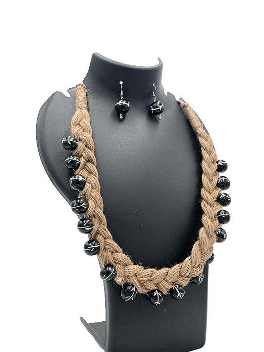 Side view of hand-braided jute necklace with bold black beads – The Chakmak