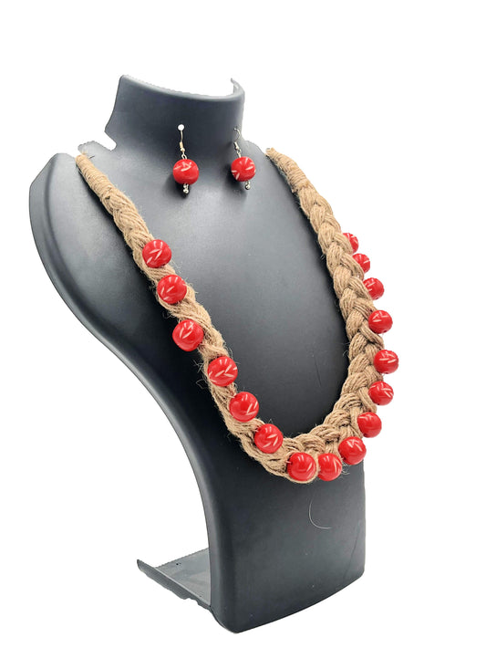 Side view of hand-braided jute necklace with vibrant red beads – The Chakmak