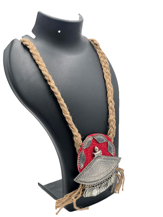 Side view of red-threaded jute necklace with vintage coin pendant – The Chakmak