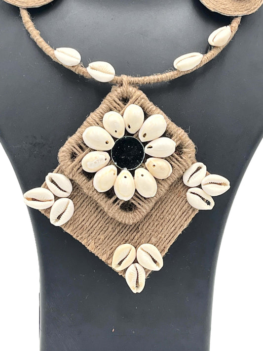 Close-up of Cowrie Shell Floral Pendant with Black Stone Center – The Chakmak