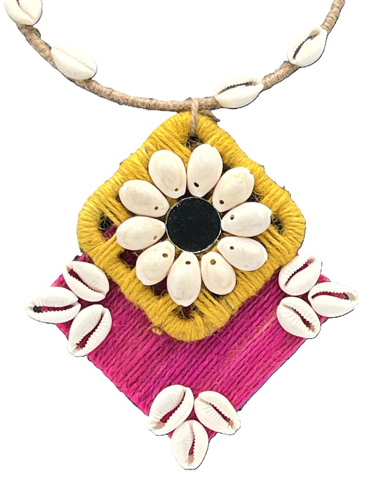 Close-up view of Gulmohar Glow Edition pendant with cowrie shells