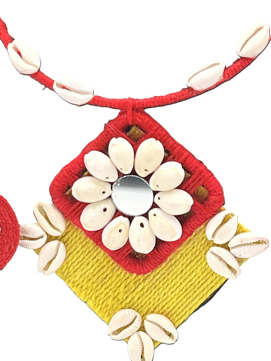 Close-up of Handcrafted Cowrie Shell Pendant with Mirror Center – The Chakmak