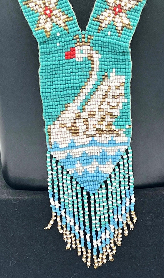 Close-up of Beaded Swan Motif Necklace with Blue Water Design – The Chakmak