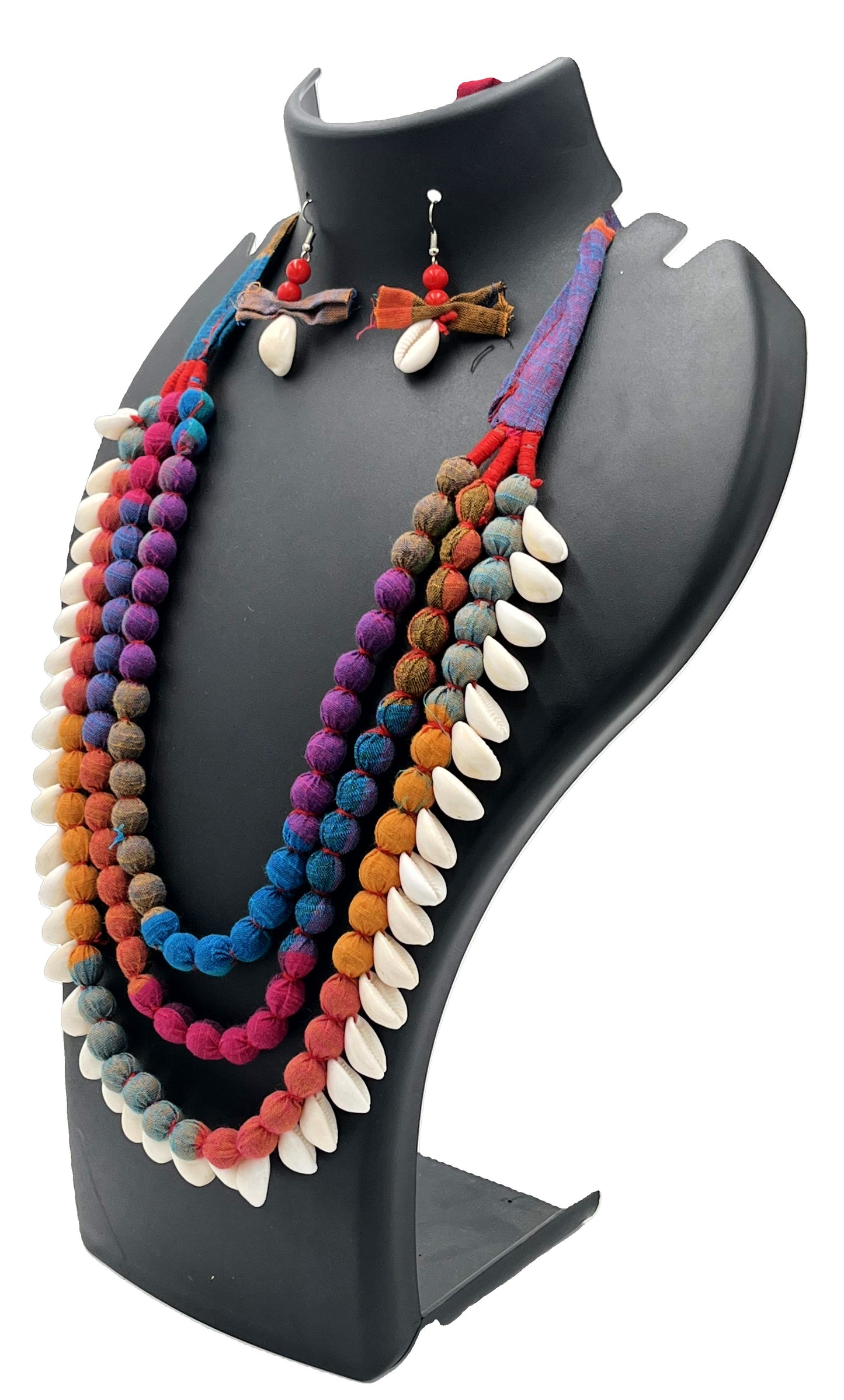 Colorful beaded necklace and earrings on a black jewelry stand against a white background