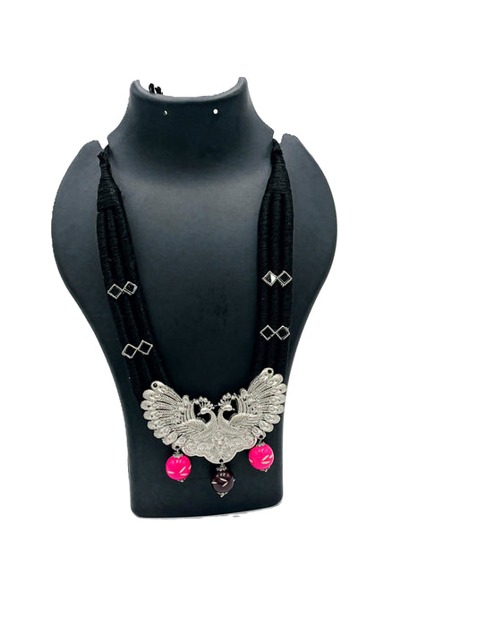 The Chakmak Rang Tarang – Black Thread Necklace with Dual Peacock Oxidized Pendant & Pink-Bead Danglers