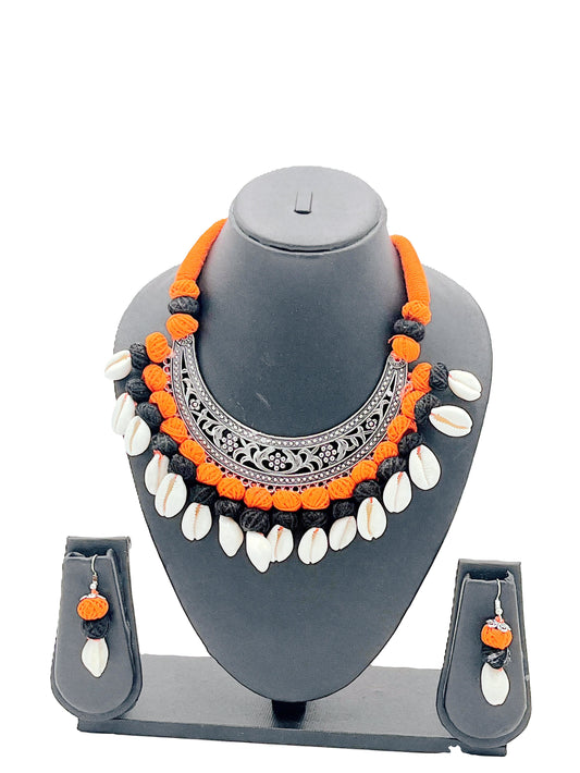 The Chakmak Rang Tarang – Handcrafted Orange & Black Thread Cowrie Shell Necklace Set with Oxidized Crescent Pendant | Navdurga Jewellery