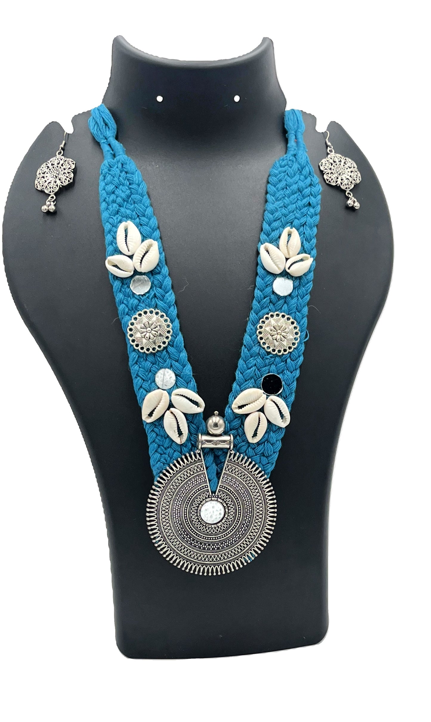 Handcrafted teal blue thread necklace set with cowrie shells and oxidized round tribal pendant – The Chakmak Rang Tarang Collection