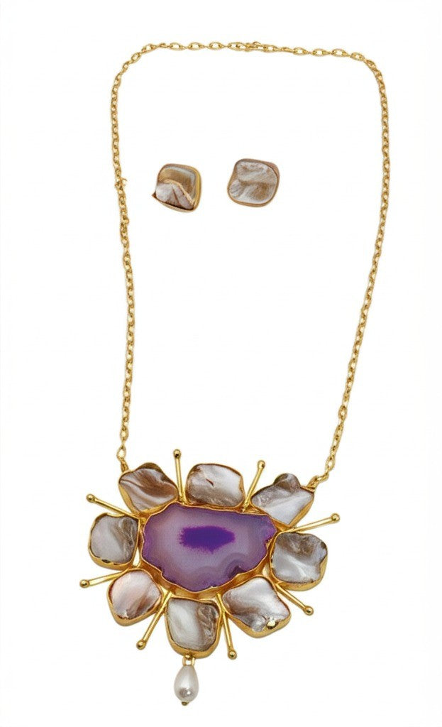 Barooqe Pearl Necklace with a purple center and gold accents, accompanied by matching earrings on a white background.