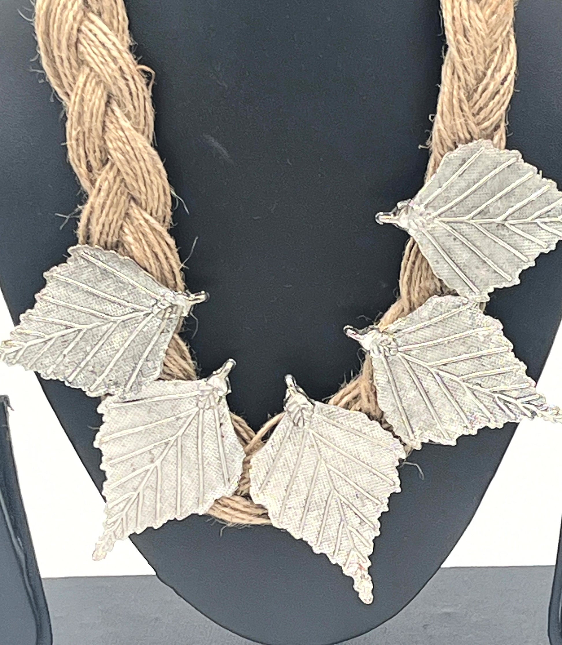 Handcrafted boho necklace with silver-toned leaves and jute cord – The Chakmak