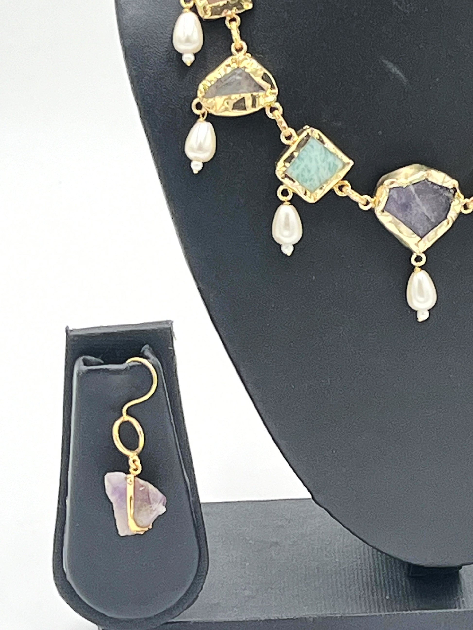 Side view of raw-cut stone necklace with pearl drops – The Chakmak Jewellery"