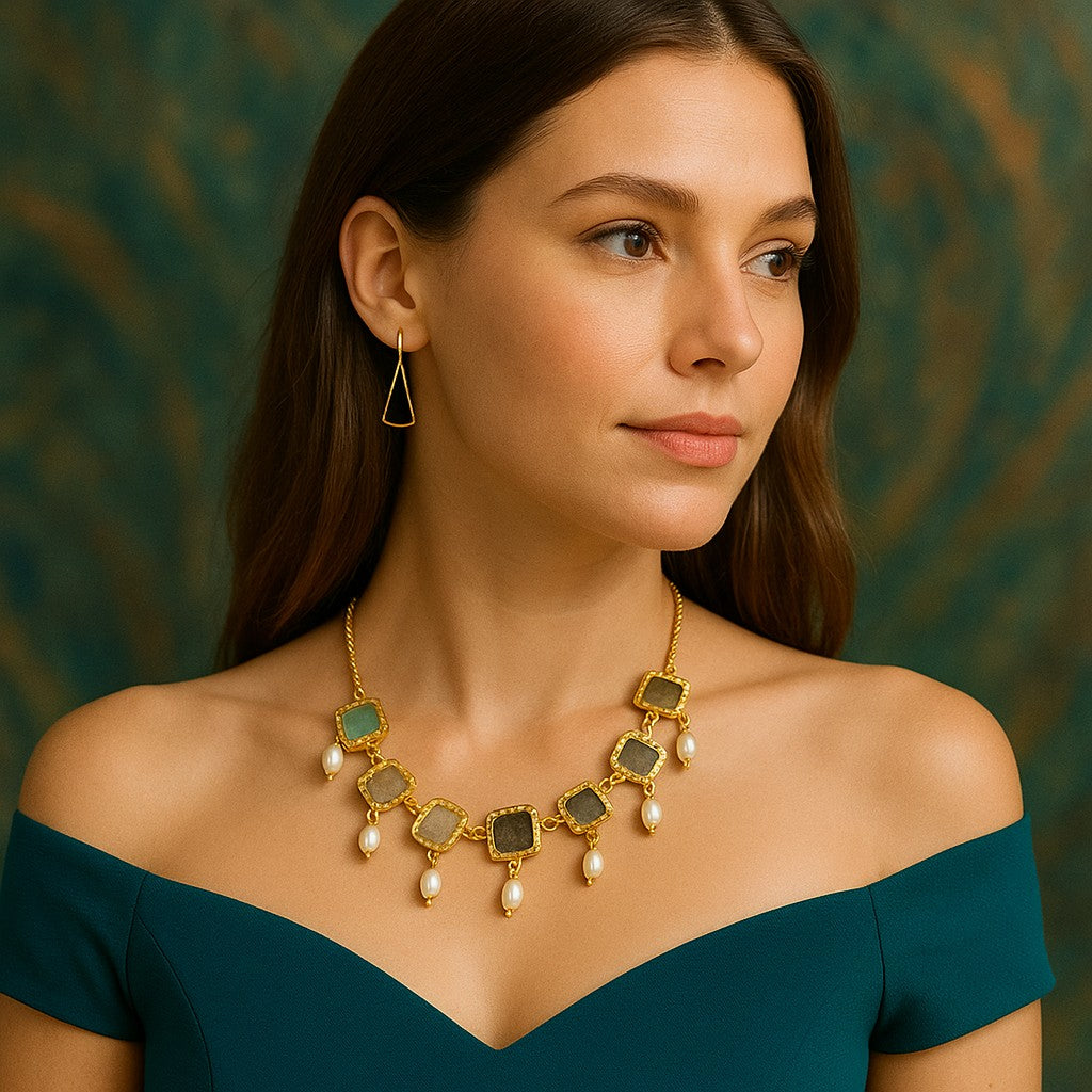 Model wearing handcrafted natural stone necklace with statement earrings – The Chakmak