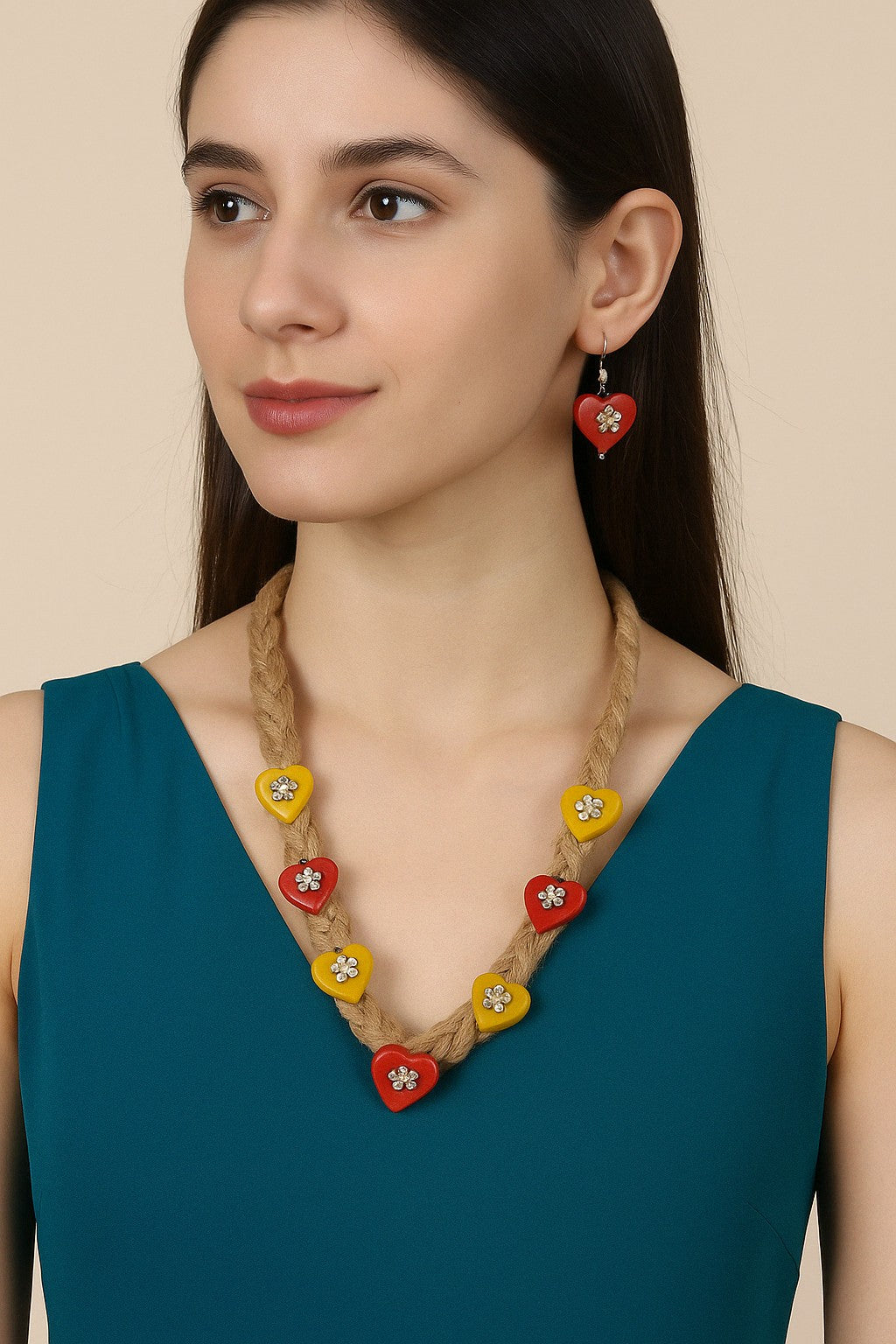 Woman wearing a colorful beaded necklace and earrings against a beige background