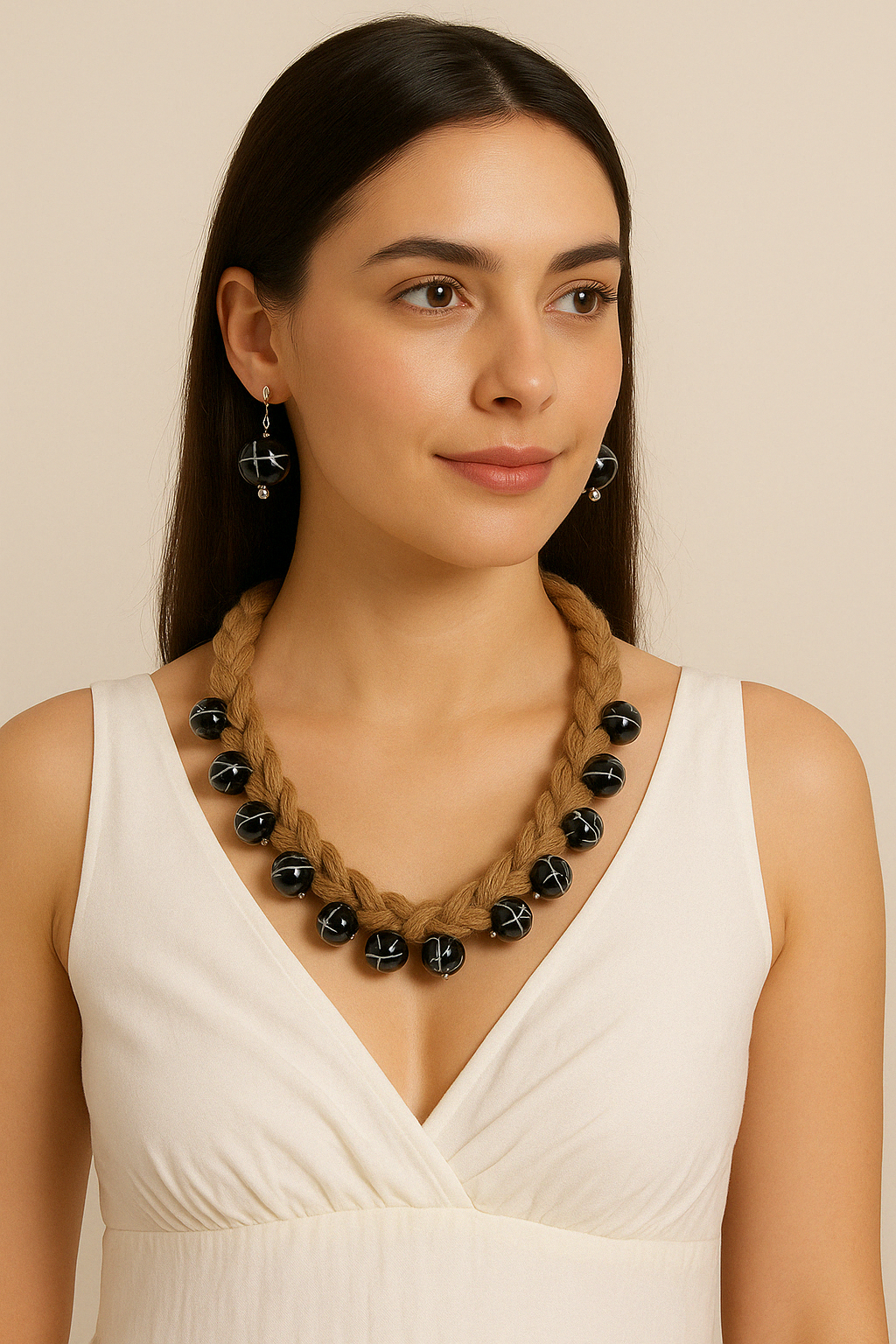 Side view of hand-braided jute necklace with bold black beads – The Chakmak