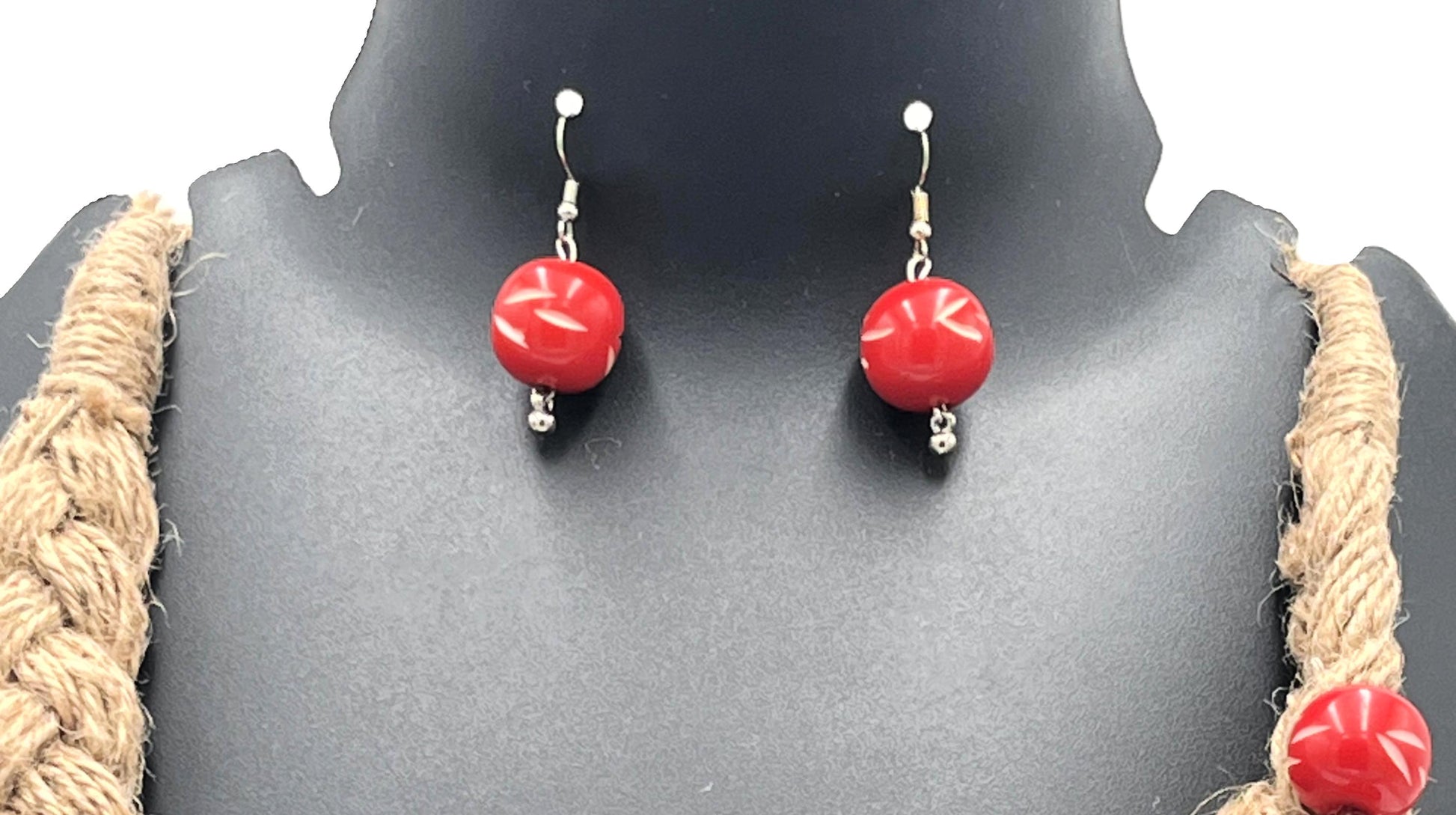 Close-up of red resin bead earrings with jute necklace – The Chakmak