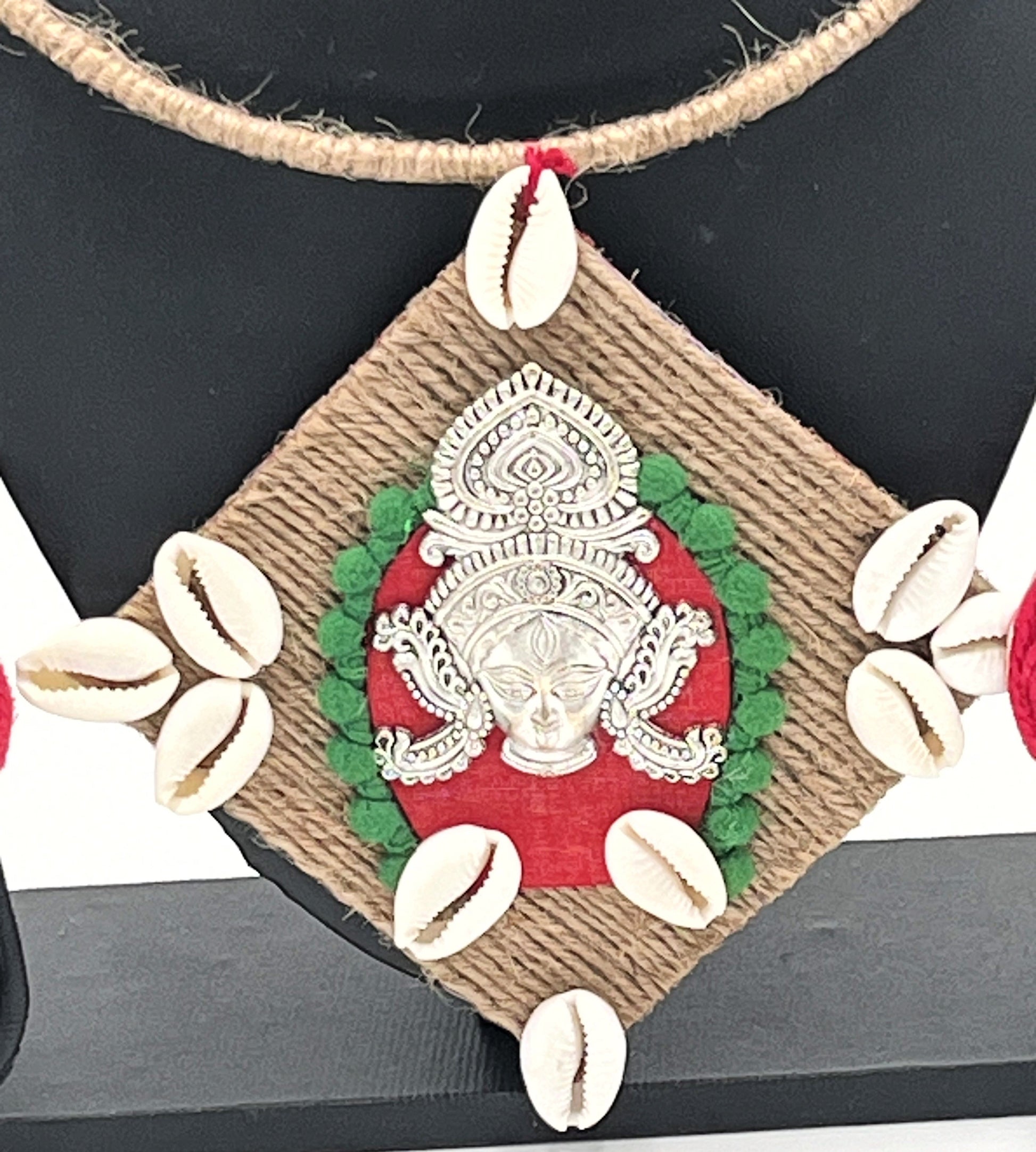 Close-up of handcrafted jute Hasli necklace with goddess pendant – The Chakmak