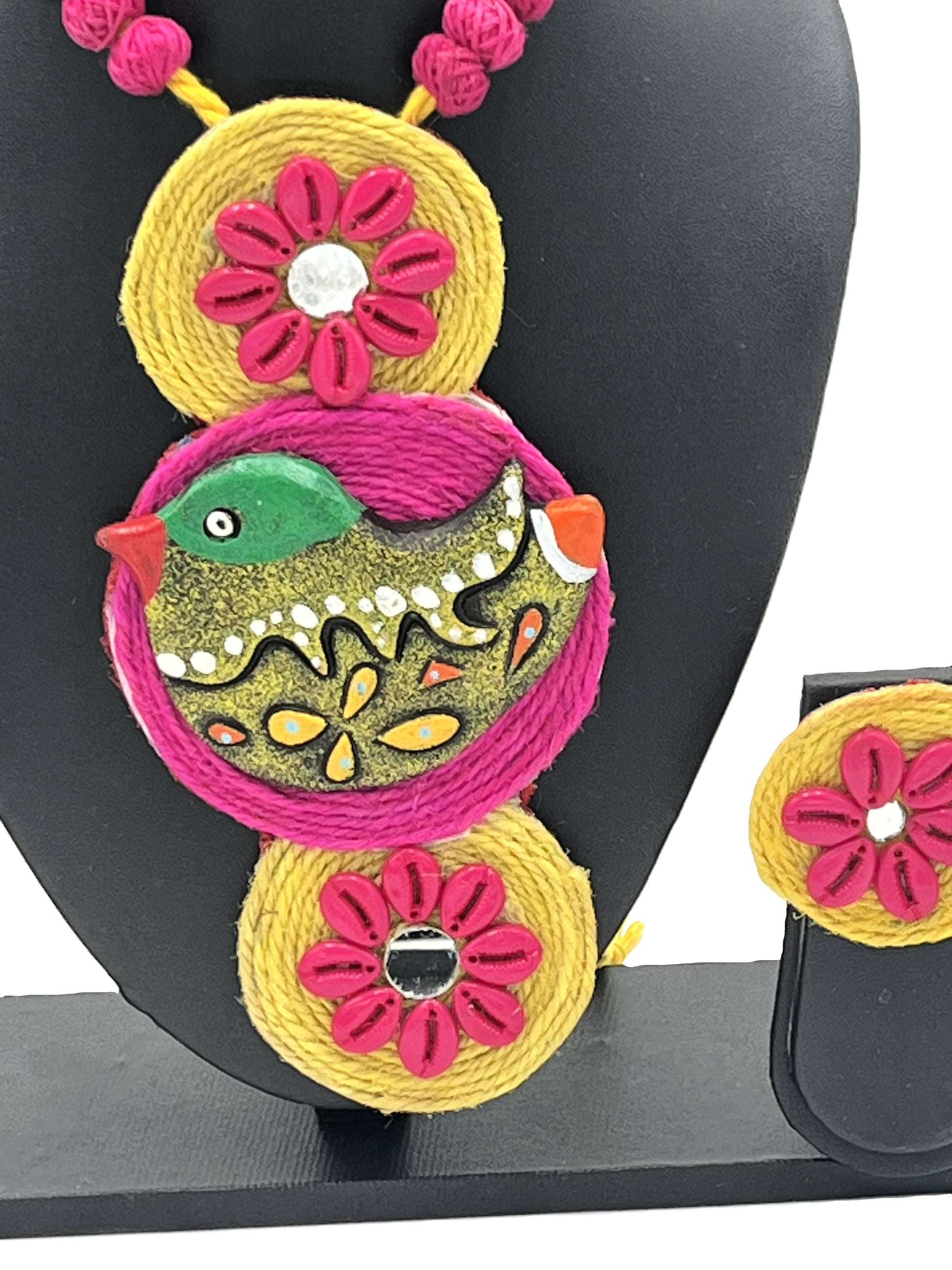 Close-up of RangPakshi Necklace Pendant – Hand-painted Terracotta Bird with Pink & Yellow Thread Embroidery