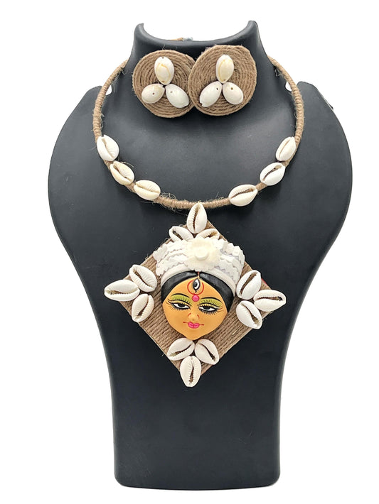 The Chakmak Shakti Hasli Necklace Set with Hand-painted Devi Face Pendant and Kodi Shells