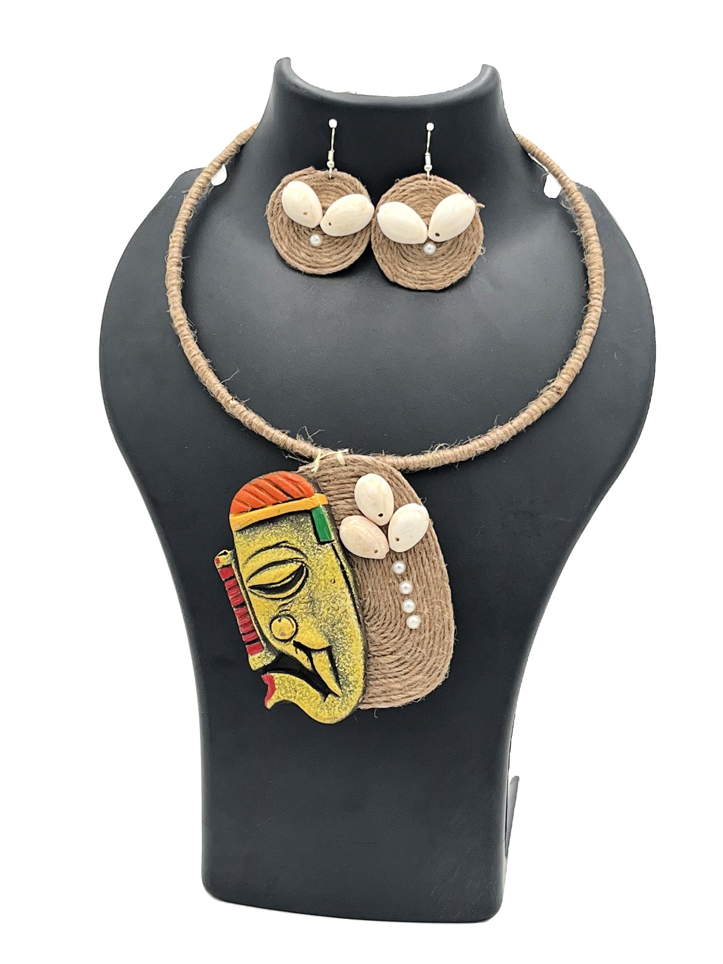 Jewelry set with a necklace and earrings on a black mannequin bust.
